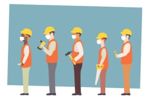 Engineers in hard hats and face masks