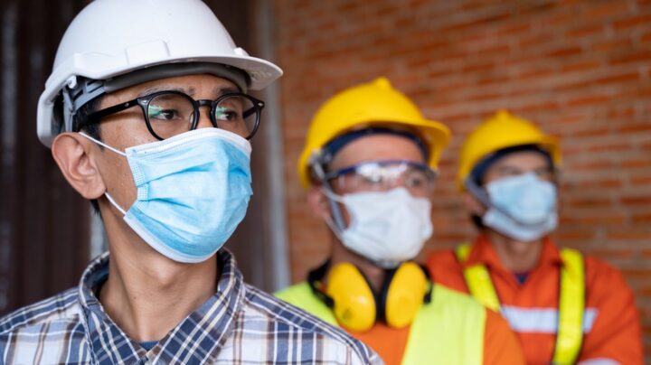 industrial engineering team wear face masks for covid-19 safety