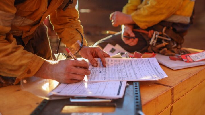 engineers filling out paperwork