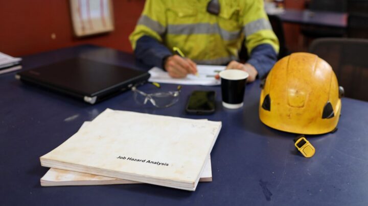 engineer working at their desk with hadhat