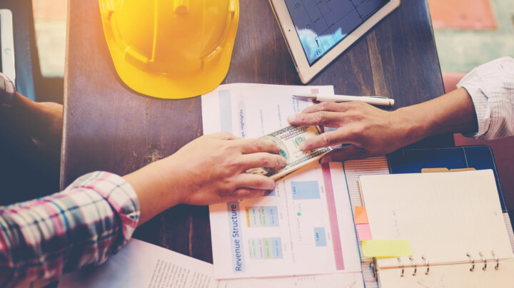 construction engineers doing corrupt deals over the table