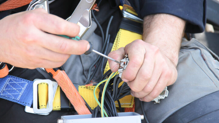 electrician working on some cables - electrical risk assessment advice from CHAS
