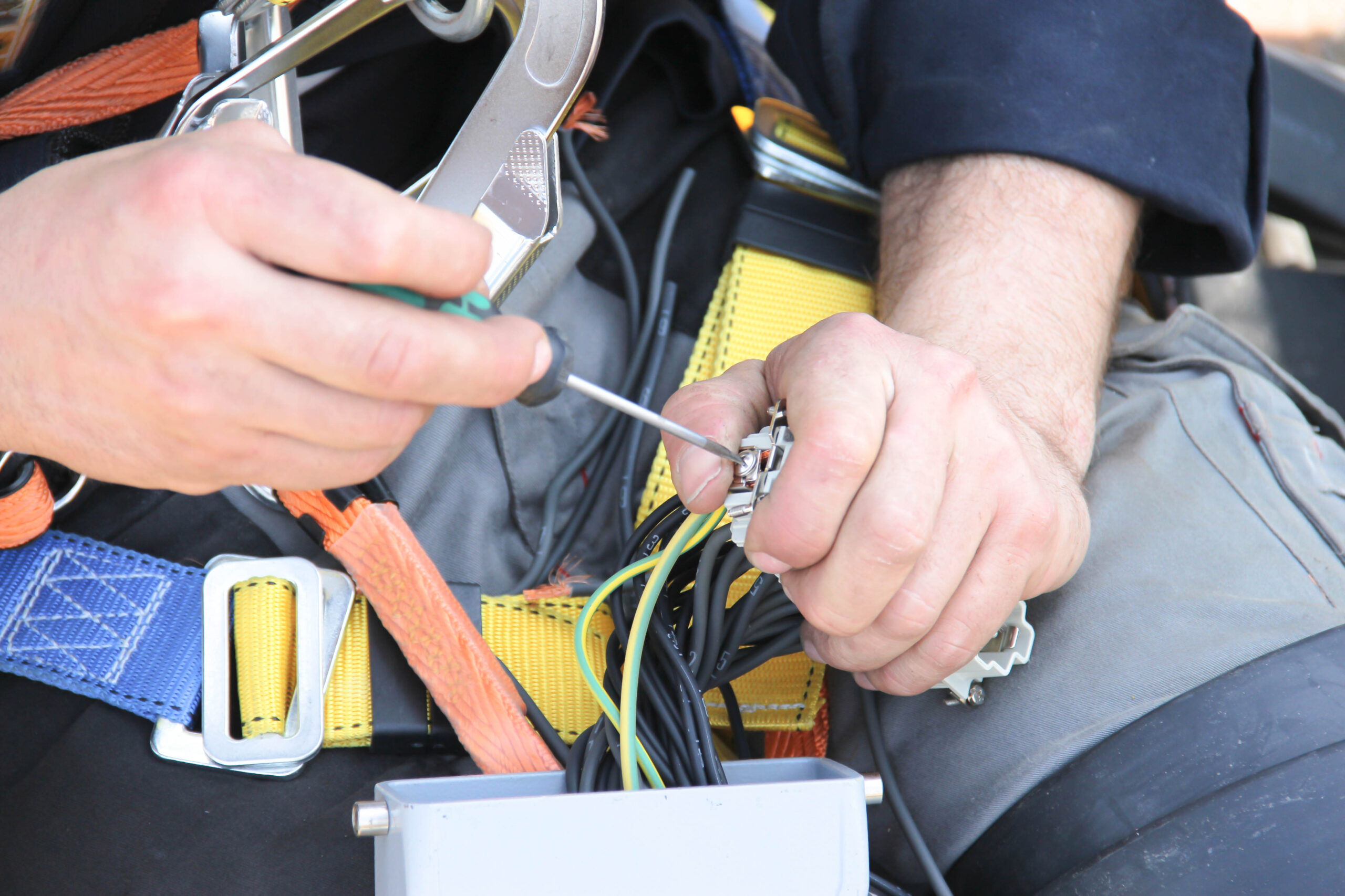 electrician working on some cables - electrical risk assessment advice from CHAS