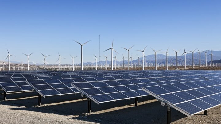 a sea of solar panels and wind farm - CHAS blog -energy based sustainable construction techniques