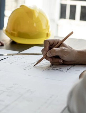 helmet and drawing plans