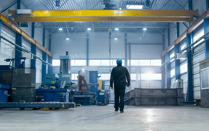 person walk through warehouse