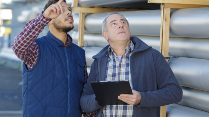 2 men talking about construction procurement