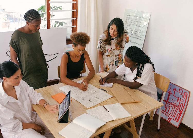 women at meeting collaborating